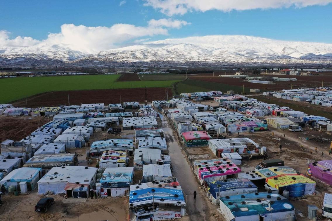An aerial view shows an informal tent settlement housing Syrian refugees in the area of Delhamiyeh, in the central Bekaa Valley.