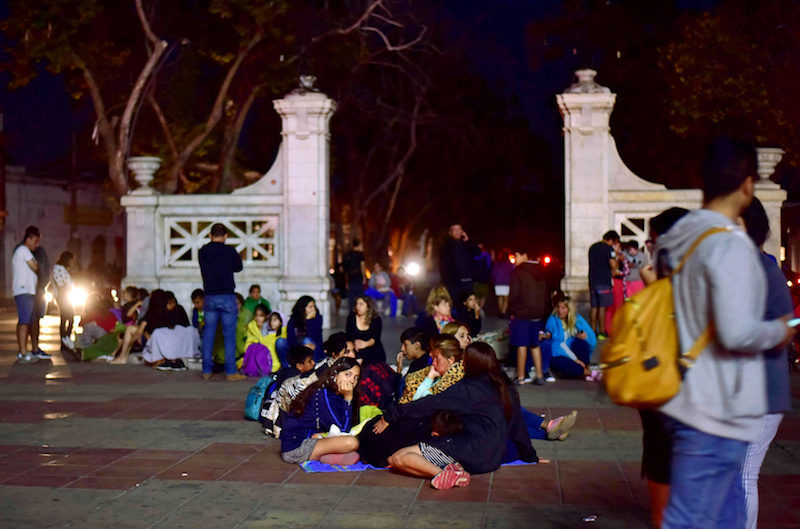 Click to enlarge People outside their houses