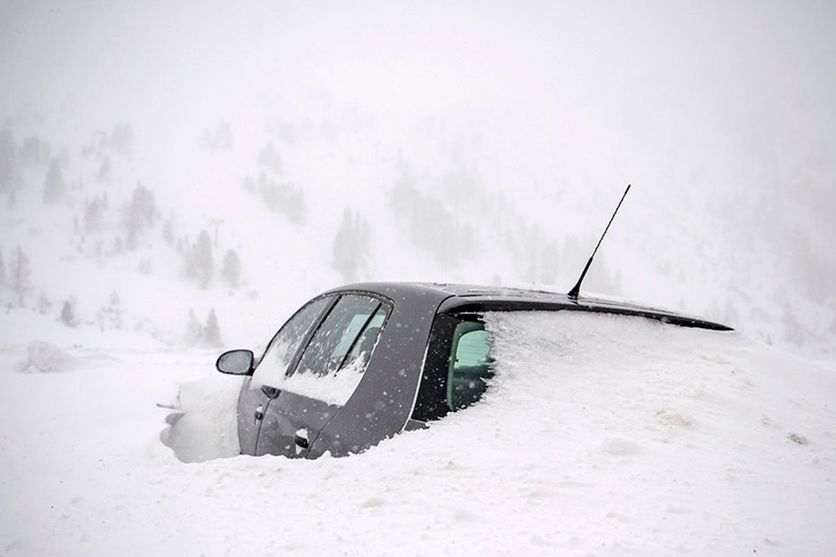 A car covered in snow in Obertauern, Austria
