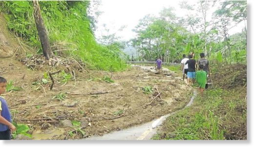 Click to enlarge A landslide renders this road at the village of LS Sarmiento in Laak town, Compostela Valley, impassable to vehicles.