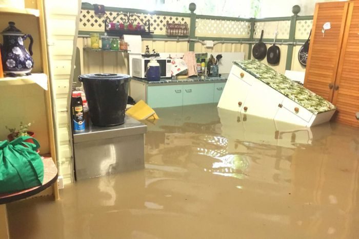 A home in Yabulu is inundated by fast rising