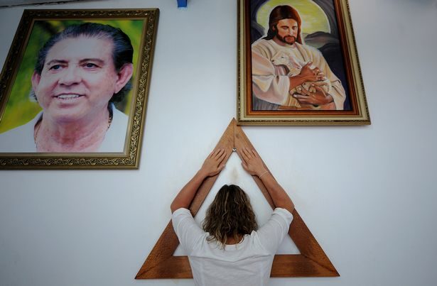 Click to enlarge woman prays