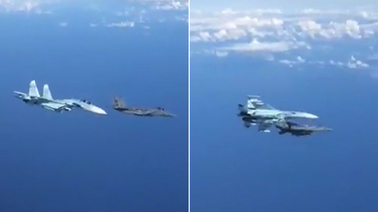 Su-27 jet fighter confronting an F-15