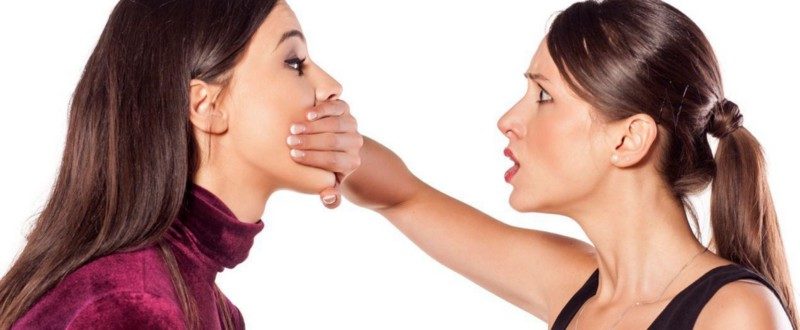 woman covering mouth