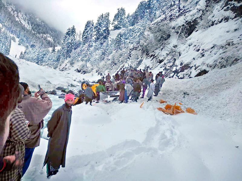 Dead bodies of avalanche victims being removed to Pahalgam by the villagers.