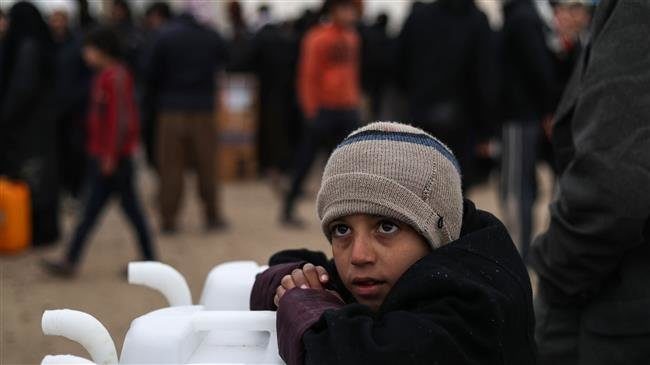 Syrian boy coping with winter weather