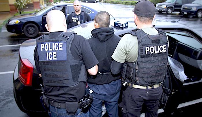 Click to enlarge police ICE arrest