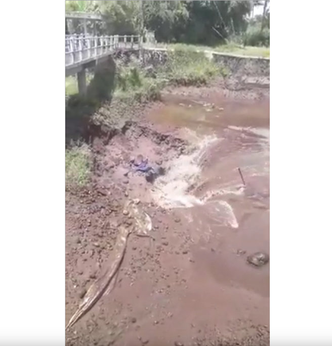Click to enlarge sinkhole swallow indonesia river