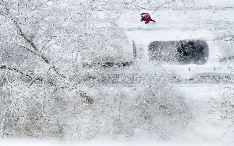 Click to enlarge Some seven centimetres (2.8 inches) of snow fell overnight, according to the national meteorological service, with drifts reaching up to 45 centimetres (18 inches).