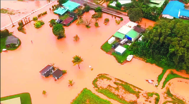 Click to enlarge Flooding along Kauai’s Hanalei Bay
