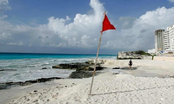 Beach with red flag
