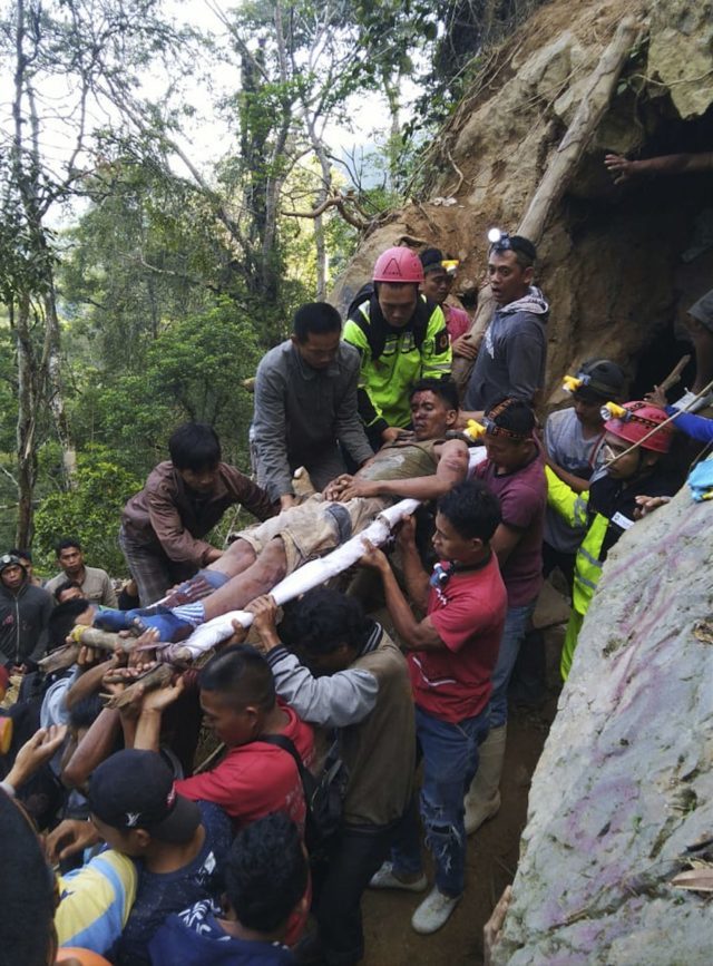 Rescuers evacuate a survivor