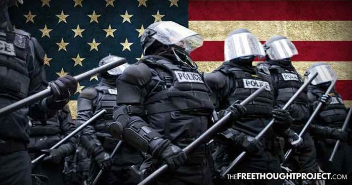 Click to enlarge police in front of american flag