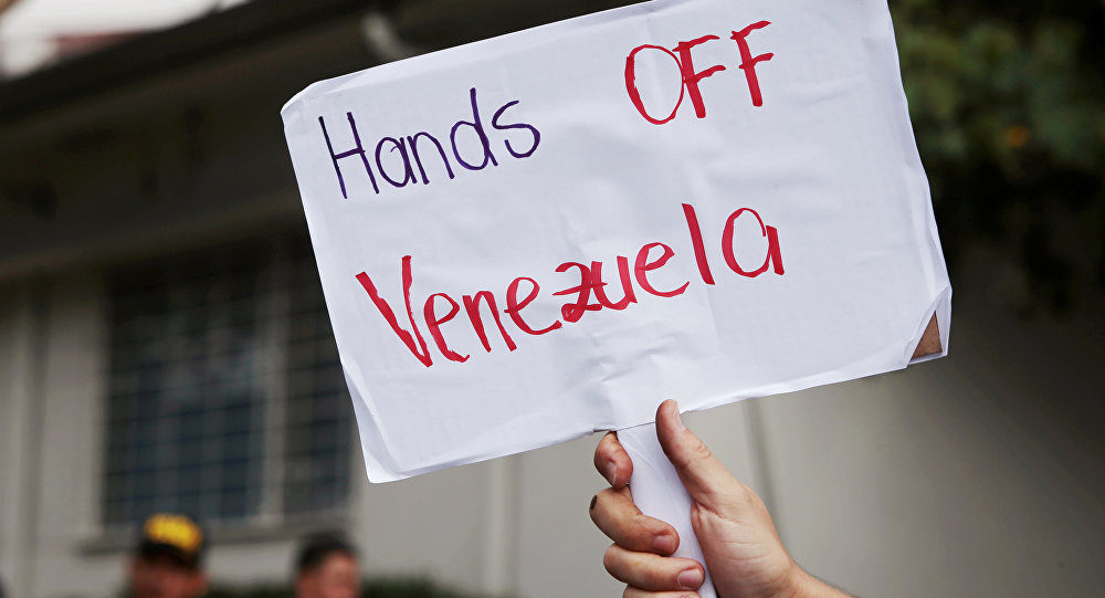 hands off venezuela protest sign