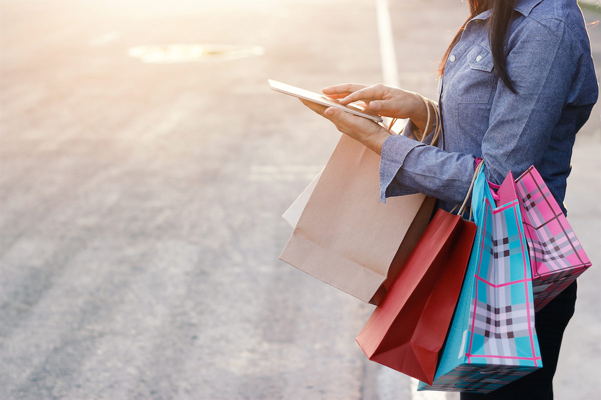 Click to enlarge woman iphone tablet shopping