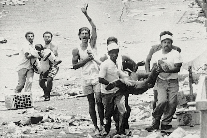 men carry bodies
