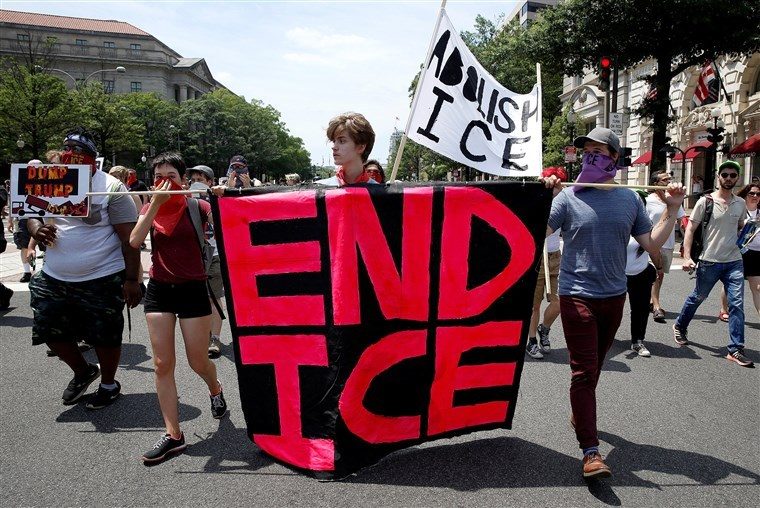 Click to enlarge sign calling for the abolishment of ICE