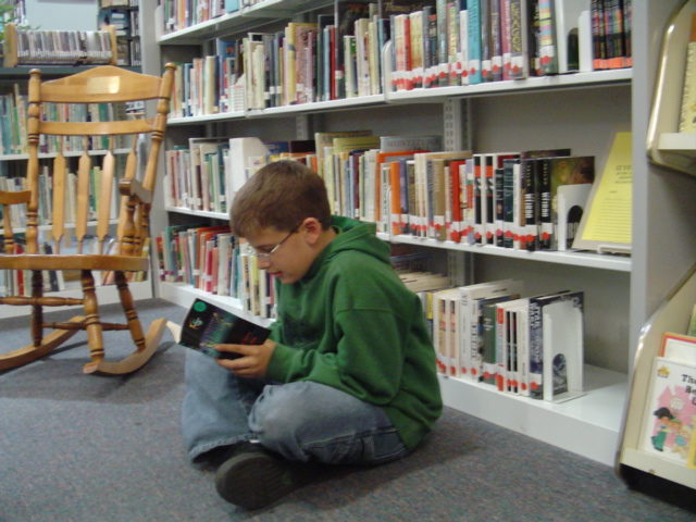 child at library