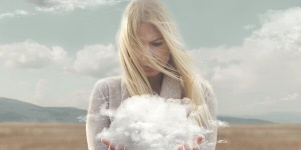 blonde woman holding cloud