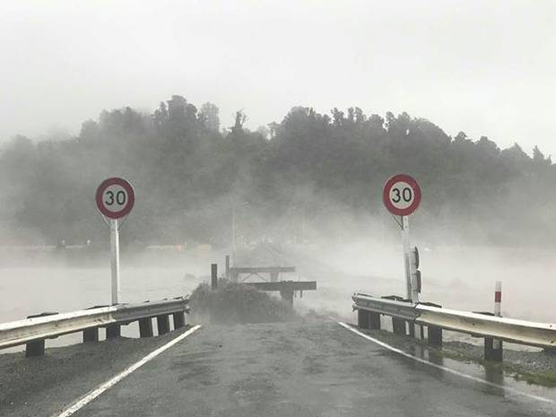 Click to enlarge Waiho bridge washed away in the river.