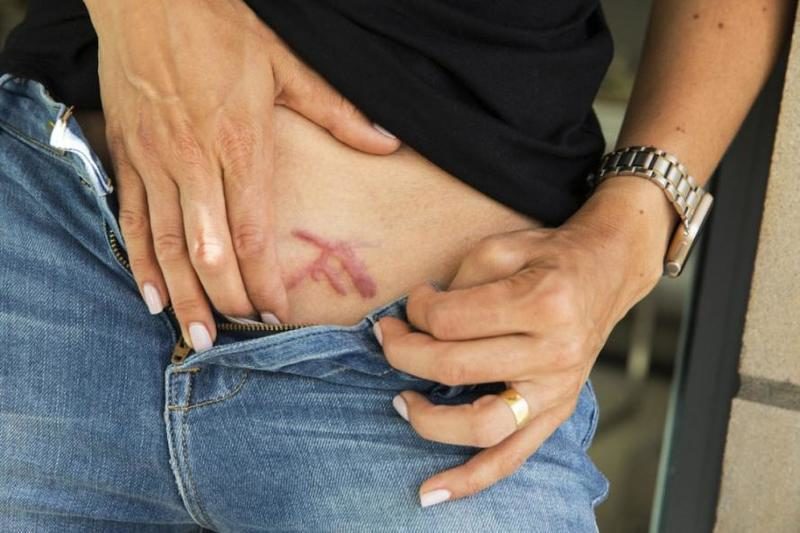 Click to enlarge NXIVM brands sex slaves