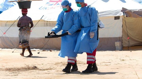Click to enlarge Chinese doctors spray chemicals