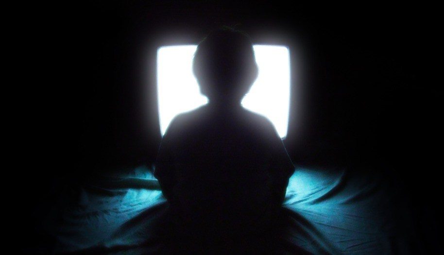 kid watching TV