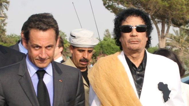 Click to enlarge Nicolas Sarkozy (L) with Gaddafi