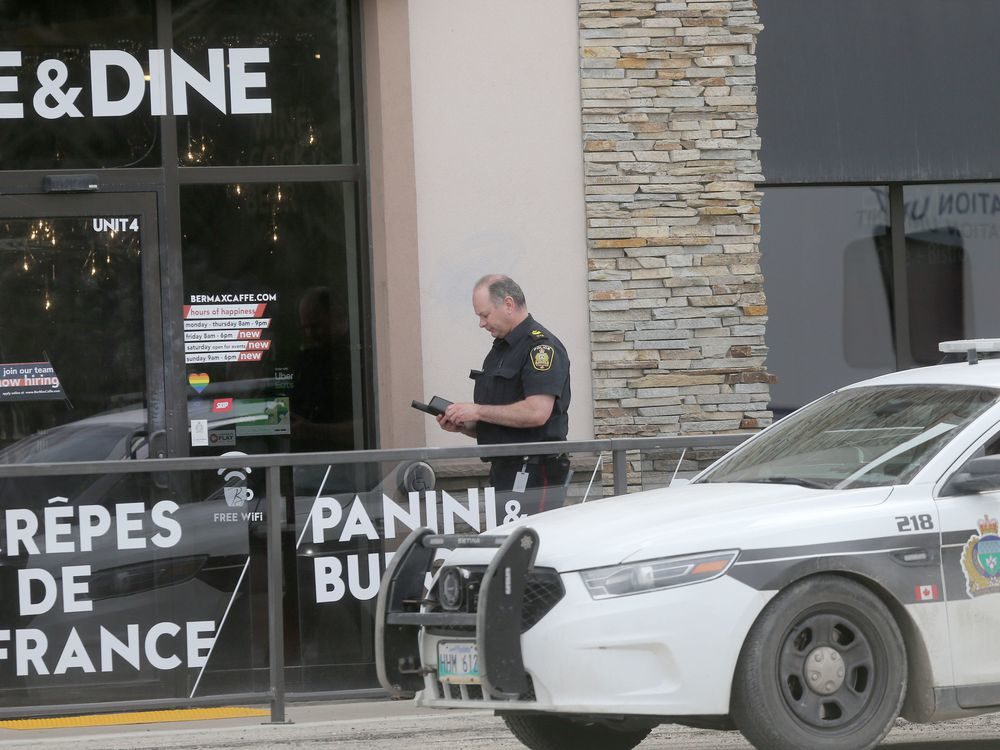 Winnipeg police at the scene of a Jewish-owned cafe on Corydon Avenue last week.
