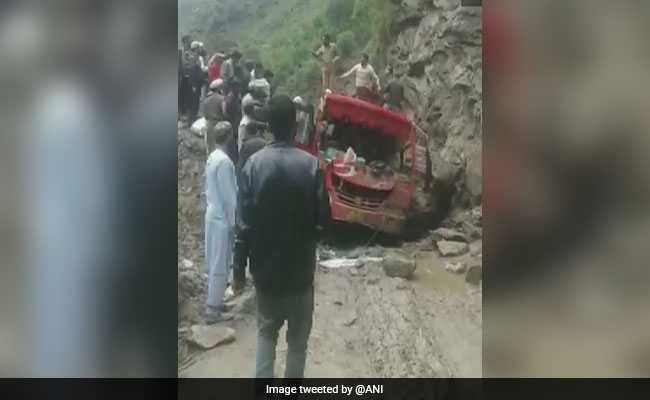 The mini bus was crossing a muddy patch when it came under debris and rocks.