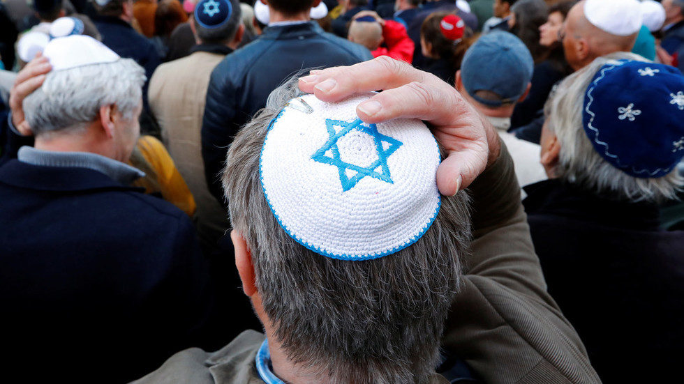 demonstrator wears a skullcap