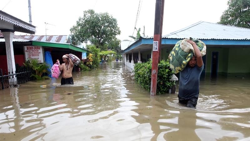 Residents are salvaging belongings as floodwaters submerged their homes