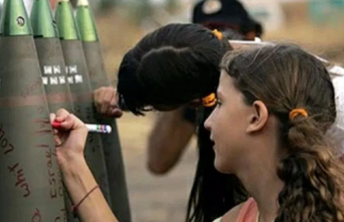 Click to enlarge Girl writes on rocket shell
