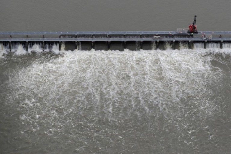 Workers open bays of the Bonnet Carré Spillway
