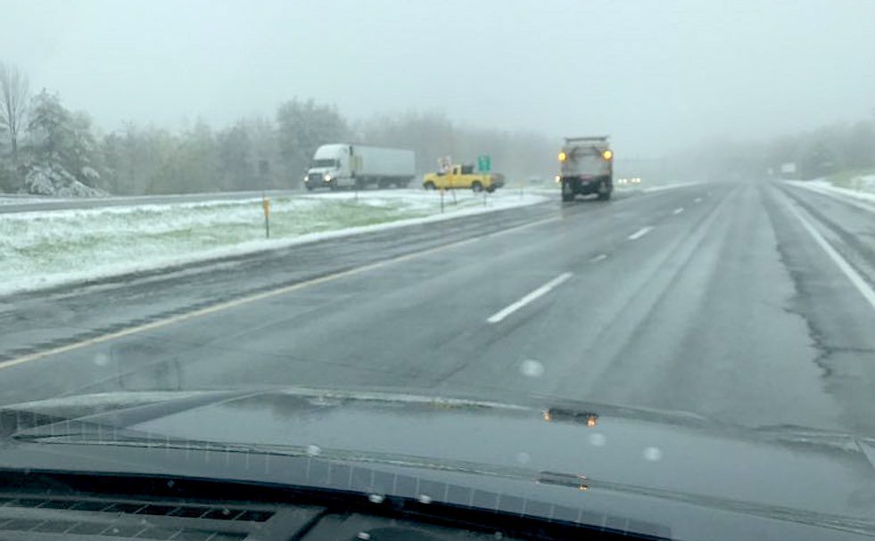Snow plows were out Sunday afternoon on I-90 in the Berkshires, where a trained weather spotter reported that roads were slick with a temperature hovering around 34 degrees Fahrenheit.