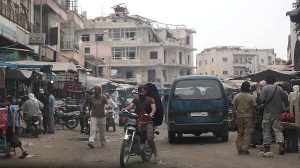 Click to enlarge A man rides on a motorbike in a crowded souk at the city of Idlib, Syria May 24, 2019