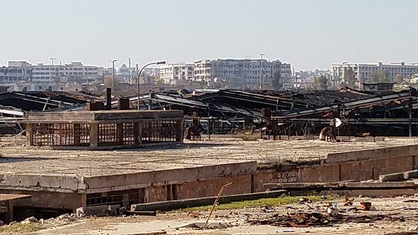 Click to enlarge Looking out from a factory in western Aleppo, just 400 metres from al-Qaeda snipers