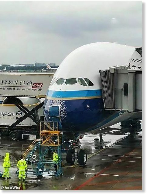 picture shows that there was paint also missing from the nose of the aircraft after it was pelted by icy drops