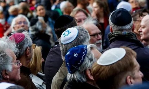 Men wear kippahs