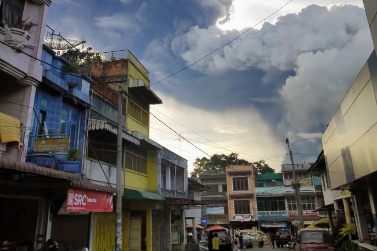 Mount Sinabung spewing thick volcanic ash into the sky, as seen from Karo, on June 9, 2019.