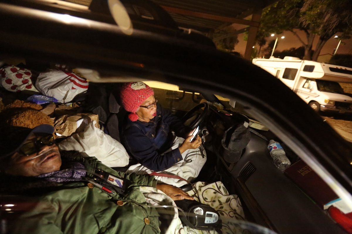 Click to enlarge The McCues sleeping in their car