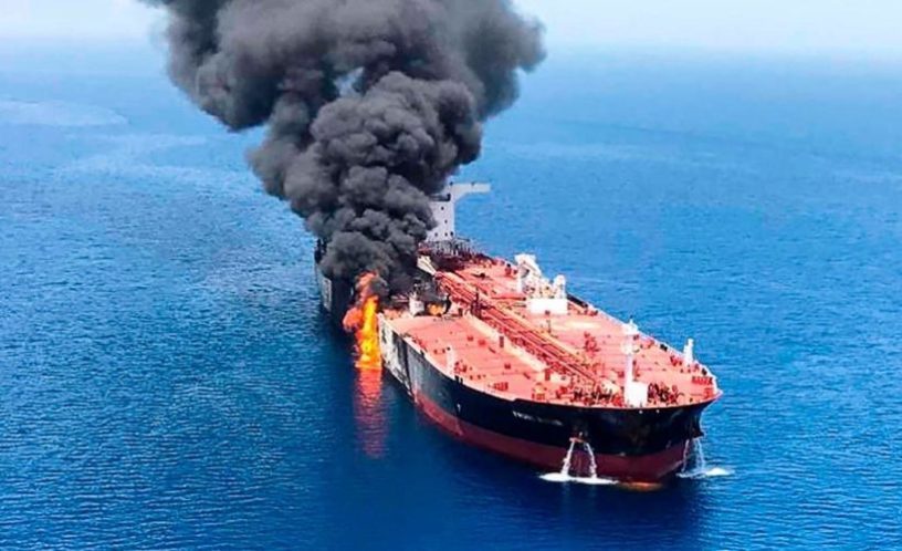 Click to enlarge An oil tanker is on fire in the sea of Oman