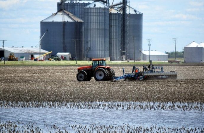 Standing water is seen near a tractor in Woodford County, Ill., June 13, 2019.
