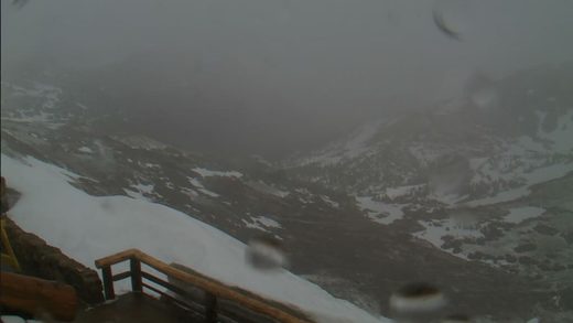 Snowstorm shuts down roads to Yellowstone and Rocky Mountain National Parks   on first day of summer