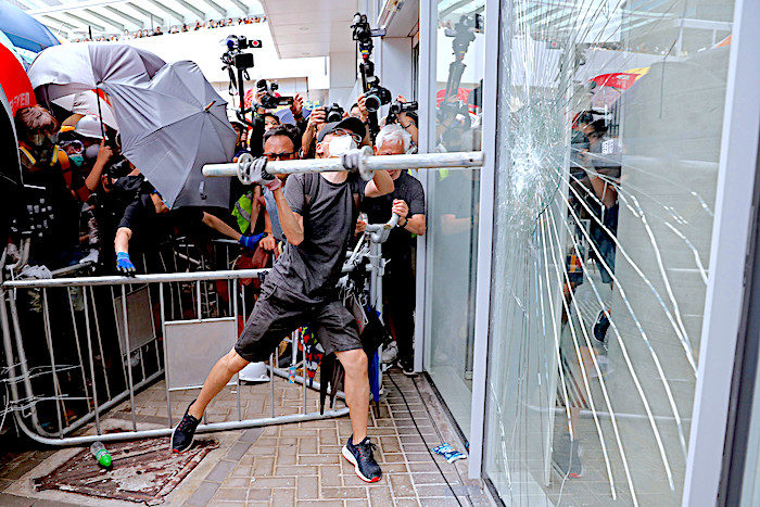 Guy with pipe smash window