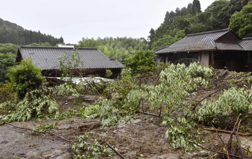 Houses are seen buried in mud in the town of Mashiki, Kumamoto Prefecture, Japan