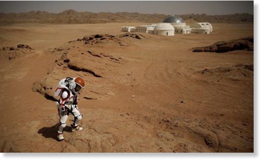 Click to enlarge A mock astronaut walks in the Gobi Desert
