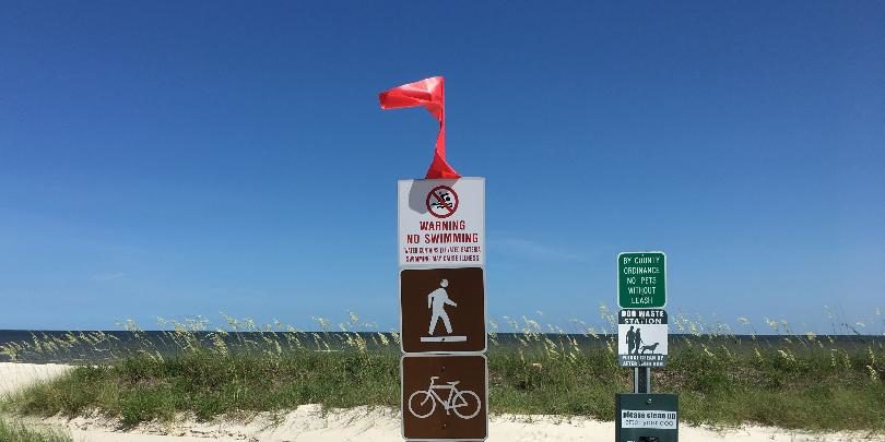 Click to enlarge Beach signs and flags in Hancock County, Miss