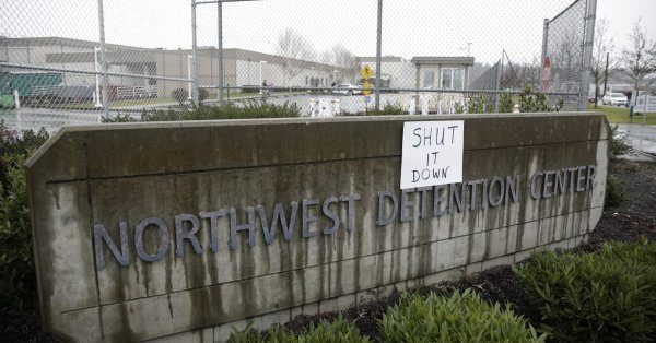 ICE facility protest sign