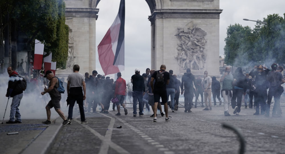 protest paris france tear gas yellow vest